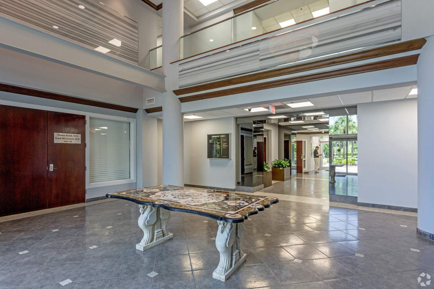 Commerce Pointe Silver lobby with a table